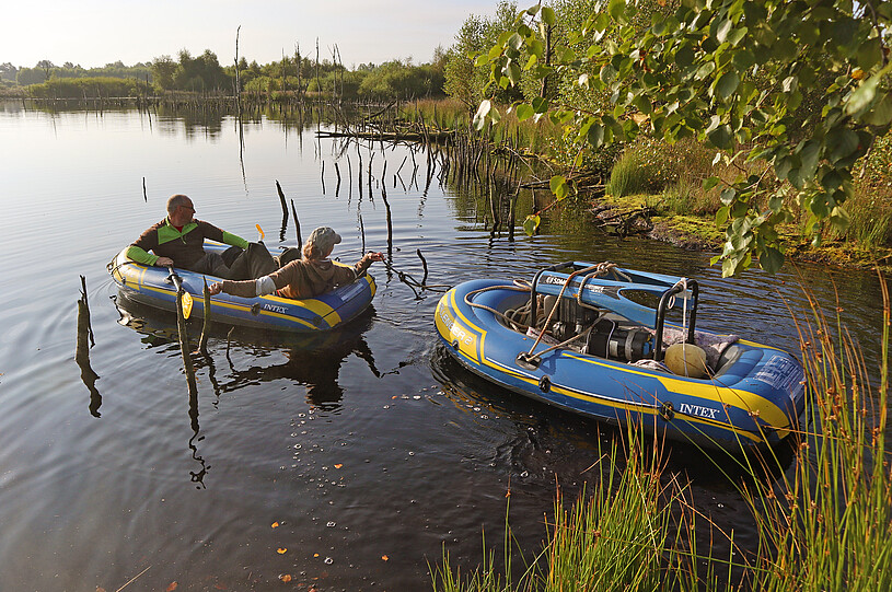 Transport of excavation equipment on Elmer lake.